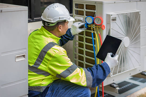 Professional Emergency Ac Repair technician working in East Nassau, NY